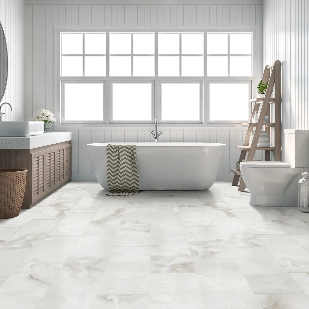 Bright bathroom with freestanding tub and wood vanity on light marble-look Shaw Floors Gemstone Matte tile flooring
