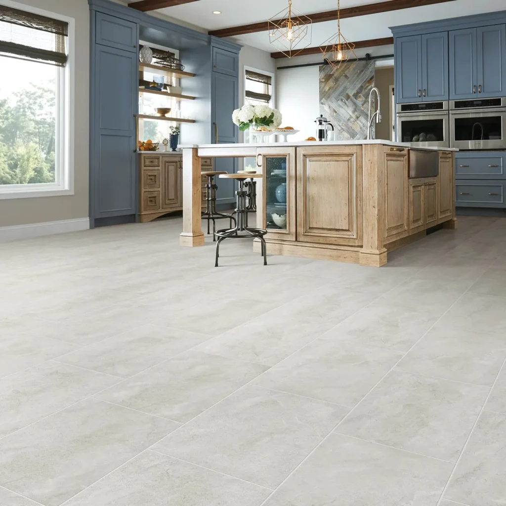 Kitchen with blue cabinets and wood island on large square cream-gray Shaw Floors Empire Mosaic tile flooring