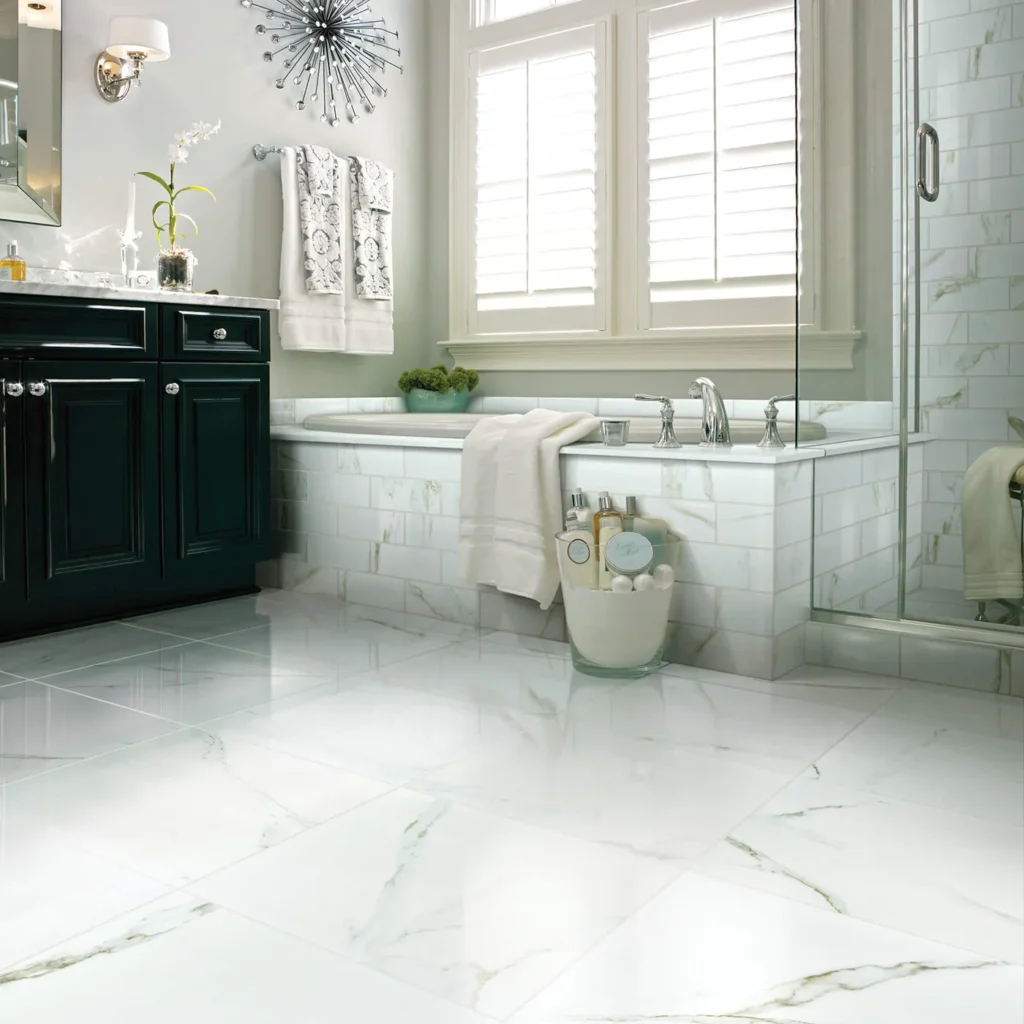 Luxurious bathroom with black vanity and tiled tub on polished white Calacatta Oro marble-look Shaw Floors Casino Polished tile