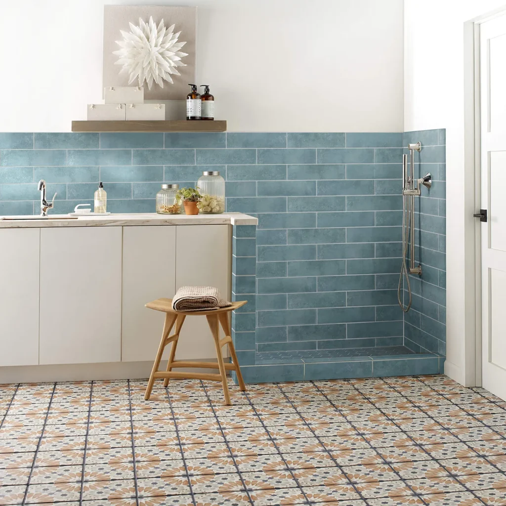 Bathroom with mint blue subway wall tile and multicolored patterned Shaw Floors Noble floor tile
