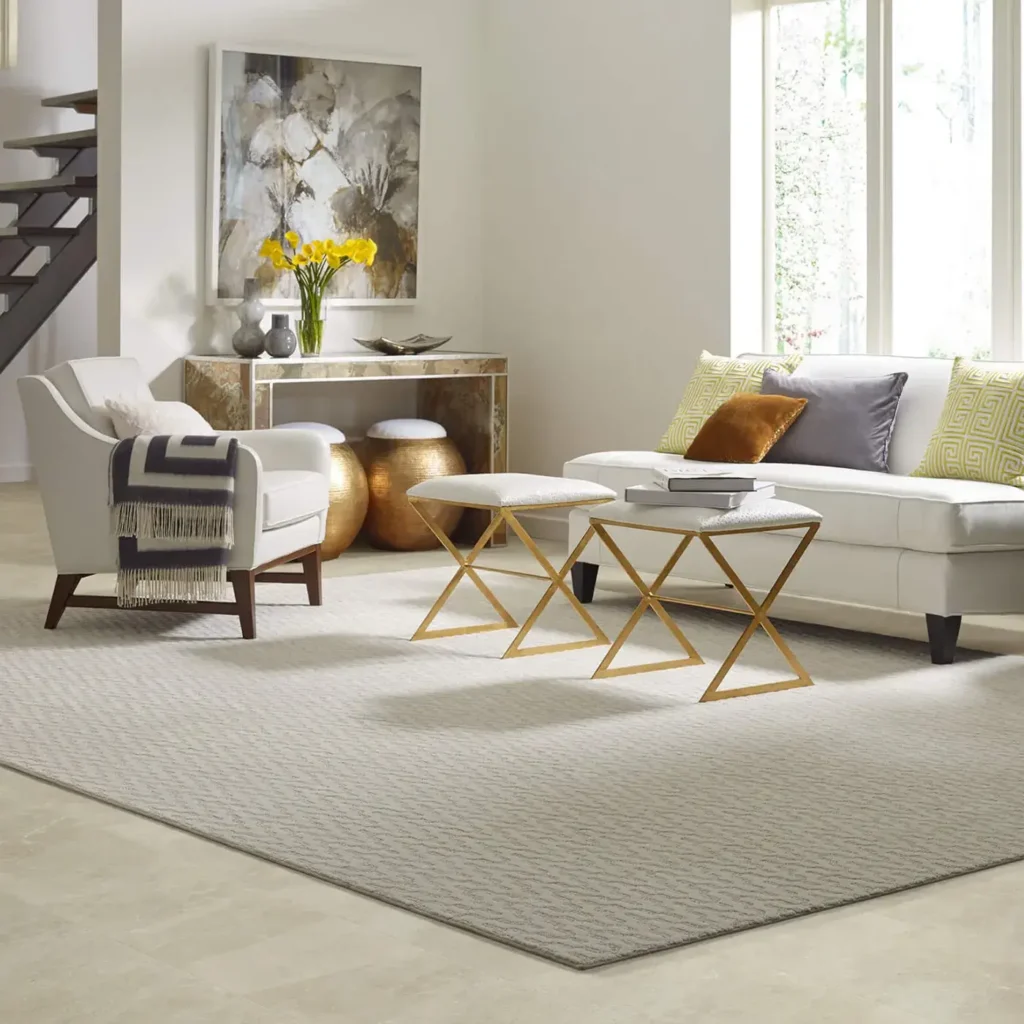 Living room with white sofa and gold side tables on a beige Shaw Floors Oasis area rug