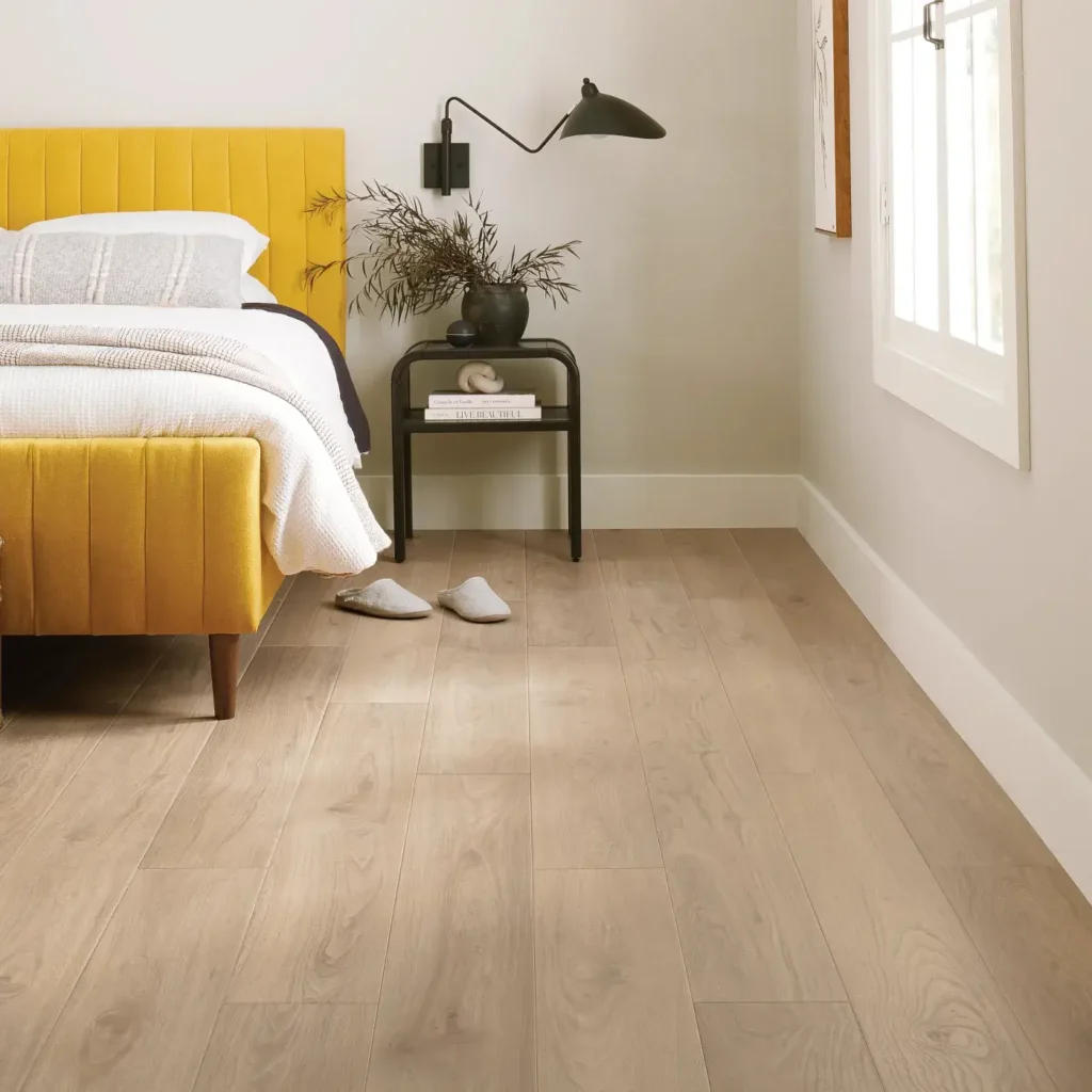 COREtec Allegiant Walnut luxury vinyl in a light blonde wood color in a laundry room
