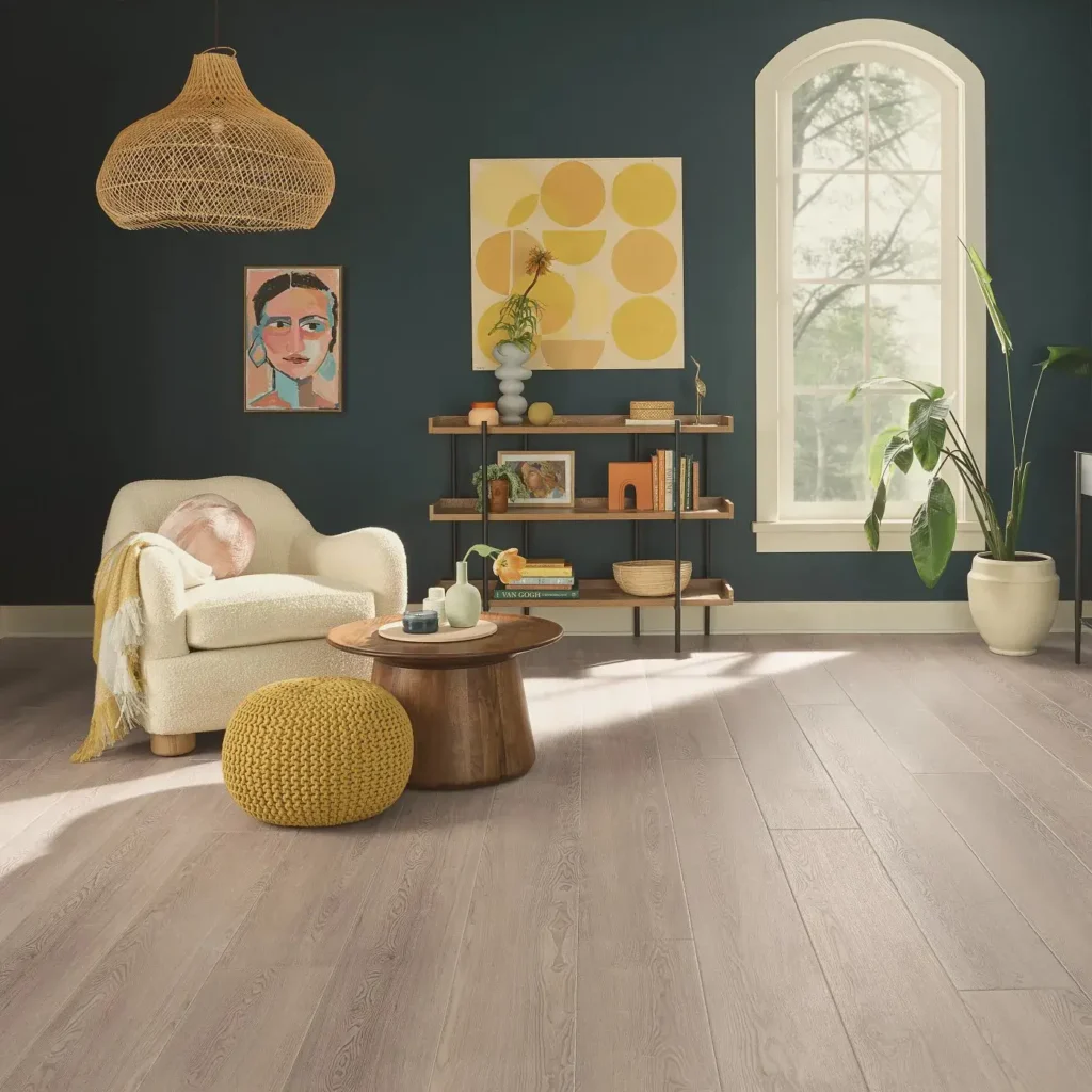 COREtec Cerith Oak luxury vinyl in a light grayish-brown wood tone in a living room