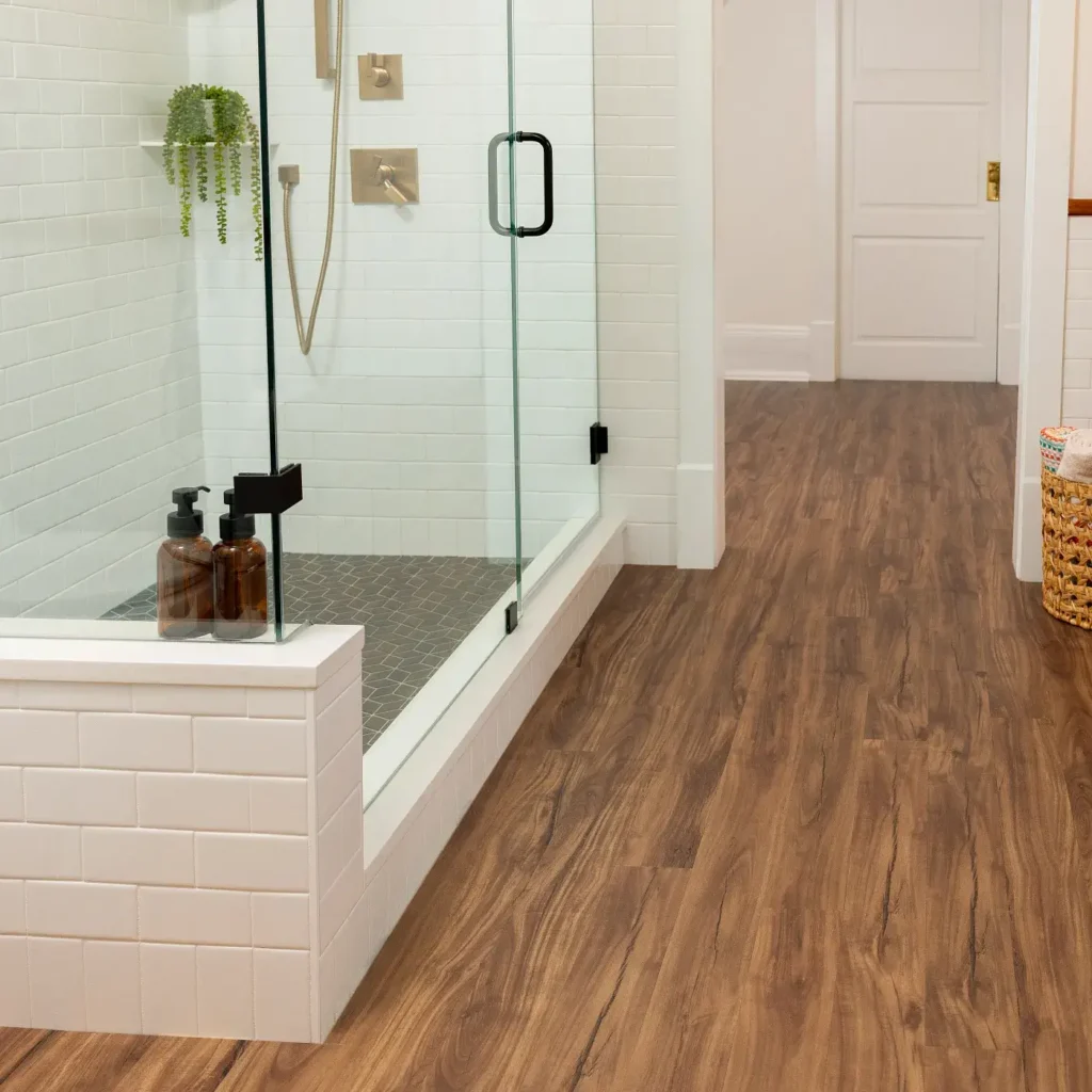 COREtec Gold Coast Acacia luxury vinyl in a medium brown wood tone in a living room