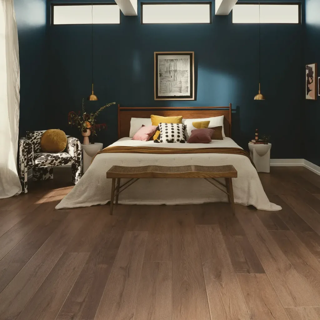 COREtec Vintage Taupe Ash luxury vinyl in a medium brown wood tone in a bedroom